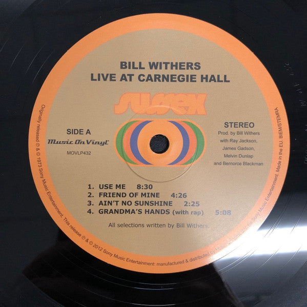 Image of Label Cover of 2xLP - NEW/NEW - BILL WITHERS, Live At Carnegie Hall (Music On Vinyl; MOVLP432, UK 2012 Reissue, Gatefold, 2 Inners, 180 Gram Vinyl), , Bill Withers' Live At Carnegie Hall was recorded almost 40 years ago on a rainy Friday evening, but it is still regarded as one of the best live performances in the history of soul music. With beautiful renditions of his classics "Ain't No Sunshine", "Use Me", "Grandma's Hands" and of course his biggest hit "Lean On Me", this shouldn't come as a surp
