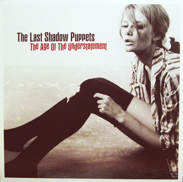 Image of Front Cover of LP - NEW/NEW - THE LAST SHADOW PUPPETS, Age Of the Understatement (Domino; WIGLP208, UK 2015 Reissue, Insert, Download Code), , The debut album for the side project of the Artic Monkeys' Alex Turner and The Rascals' Miles Kane.This isn't just a novel idea that is haphazardly hashed out but rather, the work of two impeccable musicians and it's a fine addition to either musician's catalog and a brilliant one at that.Of course the title's ironic. The most obvious comparisons (by their o