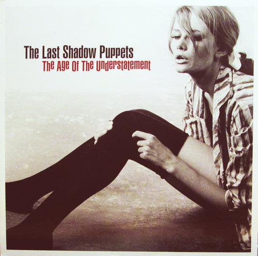 Image of Front Cover of LP - NEW/NEW - THE LAST SHADOW PUPPETS, Age Of the Understatement (Domino; WIGLP208, UK 2015 Reissue, Insert, Download Code), , The debut album for the side project of the Artic Monkeys' Alex Turner and The Rascals' Miles Kane.This isn't just a novel idea that is haphazardly hashed out but rather, the work of two impeccable musicians and it's a fine addition to either musician's catalog and a brilliant one at that.Of course the title's ironic. The most obvious comparisons (by their o