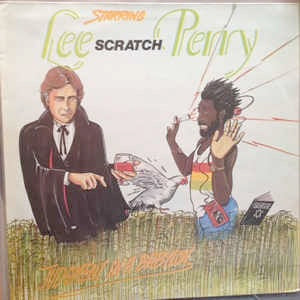 Image of Front Cover of 12" - VG/VG+ - LEE "SCRATCH"PERRY, Judgement In A Babylon / One Drop (Lion Of Judah; LPD001, UK 1985, Picture Sleeve), Clean shiny disc. Sleeve has water damage on left hand side next to spine.,  - 4016087C