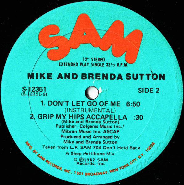 Image of Back Cover of 12" - G+/G+ - MIKE AND BRENDA SUTTON, Don't Let Go Of Me (Grip My Hips And Move Me) (Sam Records; S-12351, US 1982, Die Cut Company Sleeve), Large circular surface marks on B-side. Sleeve worn and slightly damaged at edges; general wear too, creasing, staining, A Don't Let Go Of Me (Grip My Hips And Move Me)B1 Don't Let Go Of Me (Instrumental)B2 Grip My Hips Accapella - 2916235C