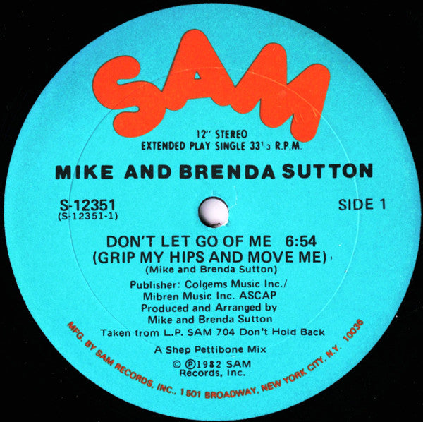 Image of Front Cover of 12" - G+/G+ - MIKE AND BRENDA SUTTON, Don't Let Go Of Me (Grip My Hips And Move Me) (Sam Records; S-12351, US 1982, Die Cut Company Sleeve), Large circular surface marks on B-side. Sleeve worn and slightly damaged at edges; general wear too, creasing, staining, A Don't Let Go Of Me (Grip My Hips And Move Me)B1 Don't Let Go Of Me (Instrumental)B2 Grip My Hips Accapella - 2916235C