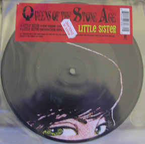 Image of Front Cover of 7" - VG/G+ - QUEENS OF THE STONE AGE, Little Sister (Interscope Records; 988 067-1, UK & Europe 2005, Stickered Plastic Sleeve, Picture Disc), Vinyl has lots of light marks.,  - 4216033C