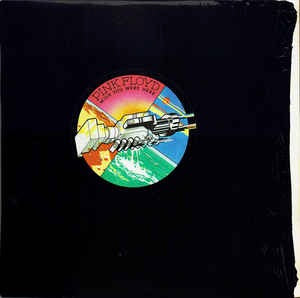 Image of Front Cover of LP - VG/VG - PINK FLOYD, Wish You Were Here (Harvest; SHVL 814, UK 1976 Reissue, Stickered Black Shrinkwrap , Inner With Rounded Corners, Postcard, A4 / B12 HTM. 2nd Issue), A few light marks/ hairlines, Glossy vinyl, With inner and postcard, Sleeve has black stickered shrinkwrap covering sleeve apart from 1.5cm at the opening where is has shrank and has a few small tears, Small tear at one side of shrink too. ,  - 1216224C