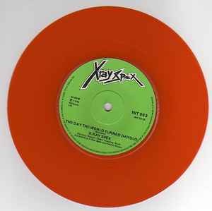 Image of Label Cover of 0656050S: 7" - X-RAY SPEX, The Day The World Turned Day-glo / Lama Poseur (EMI International; INT 553, UK 1978, Orange Vinyl.)   VG+/VG+