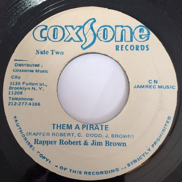 Image of Back Cover of 4614316C: 7" - RAPPER ROBERT & JIM BROWN, Pirate / Them A Pirate (Coxsone Records; , Jamaica 1983) Pressing flaws on record. Label worn and a bit damaged with sticker on it that says "SIMON BLASSE"  /G+