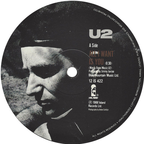Image of Label Cover of 4515417C: 12" - U2, All I Want Is You (Island Records; 12 ISB 422, UK 1989, Envelope Sleeve, Black Inner, With 4 Photo-Prints) Outer sleeve shows some light wear (VG) otherwise nice.  VG+/VG+