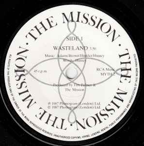 Image of Label Cover of 1614034C: 7" - THE MISSION, 1V [Wasteland / Shelter From The Storm (Edit) / Serpents Kiss / 1969] (Mercury; MYTH B2, UK 1987, Box Set, Black Inners + Band Member Photo Inserts x 4, Numbered Limited Edition) Light marks on disc. Wear to box - broken in multiple places. Number 0338.  G+/VG