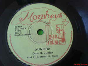 Image of Front Cover of 4915514C: 7" - VIN GORDON (DON D JUNIOR), Dunisha (Morpheus; Mor. 1002, UK 1976, Solid centre) Covered in light marks, plays well above grade.   /G+