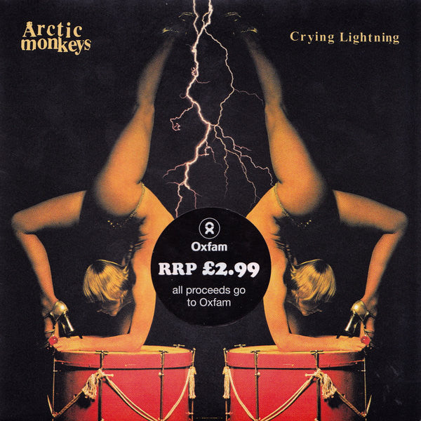 Image of Front Cover of 4624087E: 7" - ARCTIC MONKEYS, Crying Lightning / Red Right Hand (Domino; RUG338, UK 2009, Picture Sleeve With Oxfam Sticker) Strong VG, Edge Wear, Slight Sticker Damage  VG/VG