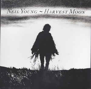 Image of Front Cover of 2xLP - NEW/NEW - NEIL YOUNG, Harvest Moon (Reprise Records; 9362-49107-8, Europe 2017 Reissue, Gatefold, Insert, Etched), , After 20 years, Neil Young finally decided to release the sequel to Harvest, his most commercially successful album. Harvest Moon (1992) is in some ways a better album, without the orchestral bombast that stifled some of the songs on the first album and boasting a more diverse overall selection of songs. Harvest Moon manages to be sentimental without being sappy