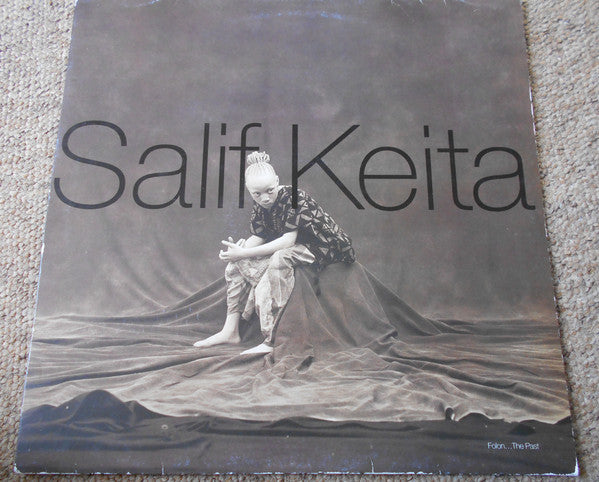 Image of Front Cover of 3414125C: LP - SALIF KEITA, "Folon"...The Past (Mango ; MLPS 1108, Europe 1995, Picture Sleeve, Inner) Minor egde wear to sleeve. Lightest of marks to vinyl. Inner is EX. Great copy all round!  VG+/VG+