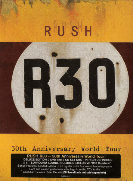 Image of Front Cover of 4054137S: 4xDVD - RUSH, R30 - 30th Anniversary World Tour (Sanctuary Visual Entertainment ; SVEDF0217, UK 2005, DVD Box Set, Booklet, 2 Guitar Picks, 2 DVDs, 2 CDs, Souvernir Backstage Pass) Minor Wear to Card Slipcase  VG/VG+