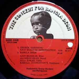Image of Label Cover of 3xLP - VG/VG - VARIOUS, The Concert For Bangla Desh (Apple Records; STCX 3385, UK 1972, Box Set, 3 Brown Inners & Booklet, Auto-Coupled. No Harrisongs Publishing Side One.), Strong VG Throughout, Glossy discs, Just a little bit of mottling/Vhemical marks to second disc, Plays fine, Intact booklet amd box, Light box wear only. ,  - 2516100C