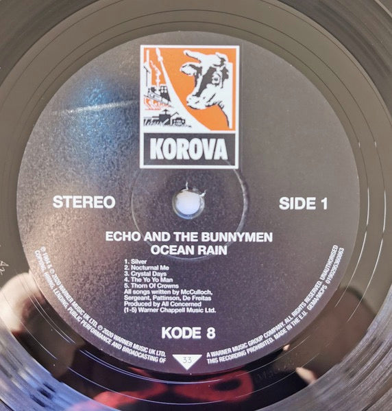 Image of Label Cover of LP - NEW/NEW - ECHO AND THE BUNNYMEN, Ocean Rain (Rocktober Exclusive) (Rhino; 0190295360863, UK 2021 Reissue, Inner), , Channeling the lessons of the experimental Porcupine into more conventional and simple structural parameters, Ocean Rain emerges as Echo and the Bunnymen's most beautiful and memorable effort. Ornamenting Ian McCulloch's most consistently strong collection of songs to date with subdued guitar textures, sweeping string arrangements, and hauntingly evocative producti