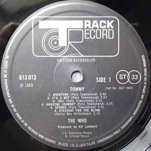 Image of Label Cover of 2xLP - G+/VG+ - THE WHO, Tommy (Track; 2657 002, UK 1973, Triple Gatefold, Booklet), Edge wear and surface rip to sleeve at base of spine.  Some light hairlines. ,  - 0926431E
