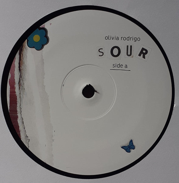 Image of Label Cover of LP - NEW/NEW - OLIVIA RODRIGO, Sour (Geffen Records  ; 3810641, USA & Europe 2021, Gatefold, Inner), , Sour is the debut studio album by American singer-songwriter Olivia Rodrigo. It was released on May 21, 2021, via Geffen Records. The album was written by Rodrigo and her producer Dan Nigro. The album title refers to the concept of "awesome things" in Rodrigo's life "progressively going sour" as she gets older, representing a specific "slice" of her life as a 17-year-old, "its unend