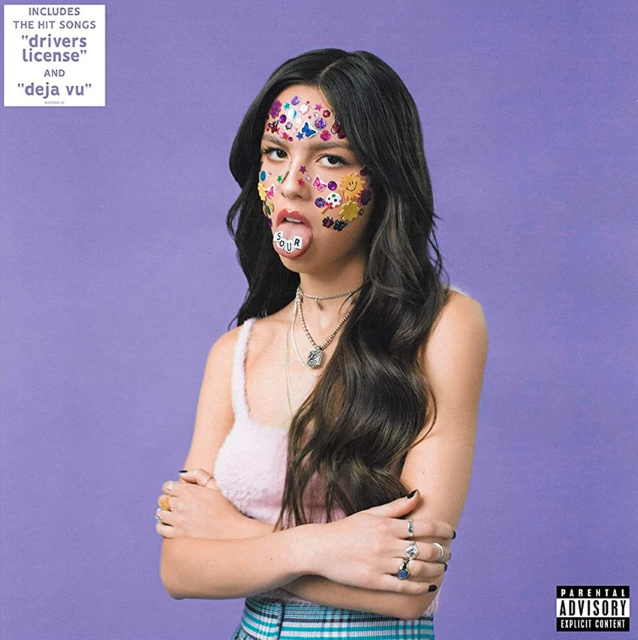 Image of Front Cover of LP - NEW/NEW - OLIVIA RODRIGO, Sour (Geffen Records  ; 3810641, USA & Europe 2021, Gatefold, Inner), , Sour is the debut studio album by American singer-songwriter Olivia Rodrigo. It was released on May 21, 2021, via Geffen Records. The album was written by Rodrigo and her producer Dan Nigro. The album title refers to the concept of "awesome things" in Rodrigo's life "progressively going sour" as she gets older, representing a specific "slice" of her life as a 17-year-old, "its unend