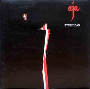 Image of Front Cover of LP - VG/G+ - STEELY DAN, Aja (ABC Orange Rings Label, Round ABC Logo; ABCL5225, UK 1977, Gatefold, NO Inner), Groove wear, hairlines, a few feelable light scratches. Slight discolouration, edge and ring wear, creasing.,  - 2746219S