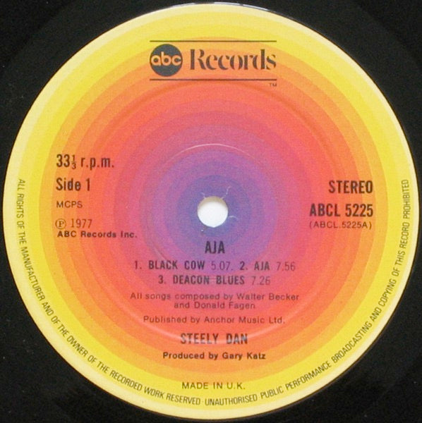 Image of Label Cover of LP - VG/G+ - STEELY DAN, Aja (ABC Orange Rings Label, Round ABC Logo; ABCL5225, UK 1977, Gatefold, NO Inner), Groove wear, hairlines, a few feelable light scratches. Slight discolouration, edge and ring wear, creasing.,  - 2746219S