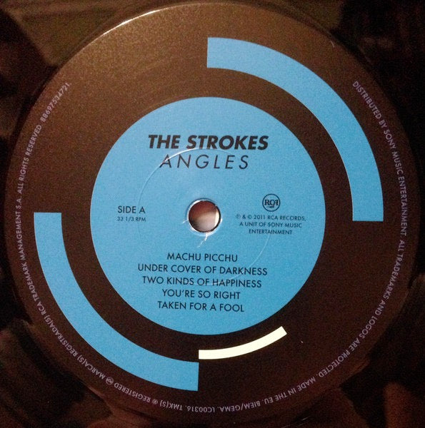 Image of Label Cover of LP - NEW/NEW - THE STROKES, Angles (RCA ; 88697534721, Europe 2011, Gatefold), , There's seldom a need to use the phrase return to form if you never really drop off, but The Strokes found themselves in a different spot for 2011's Angles, ten years since their rapid ascent and equally sudden plateau.A public re-assessment of sorts then, and one that found them in a rich vein of songwriting form - tantilizingly close to the level of Is This It. Highlights aplenty then - fan favourite