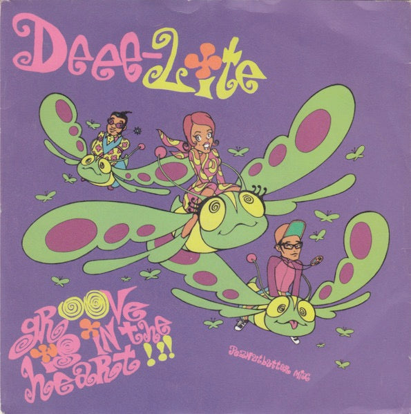 Image of Front Cover of 7" - VG/VG+ - DEEE-LITE, Groove Is In The Heart / What Is Love? (Elektra; EKR 114, UK 1990, Picture Sleeve), Ringwear on sleeve and previous sticker rip.,  - 2826028E
