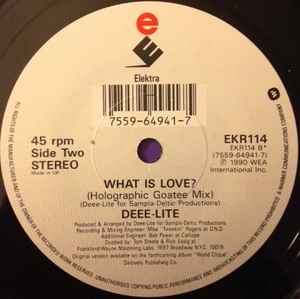 Image of Label Cover of 7" - VG/VG+ - DEEE-LITE, Groove Is In The Heart / What Is Love? (Elektra; EKR 114, UK 1990, Picture Sleeve), Ringwear on sleeve and previous sticker rip.,  - 2826028E