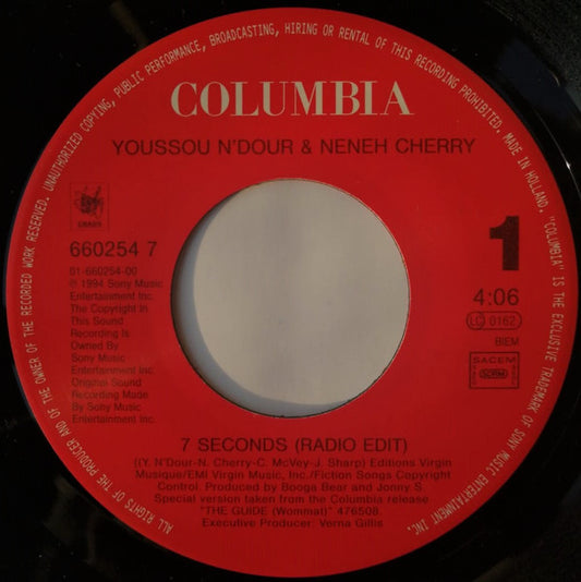 Image of Front Cover of 7" - /VG+ - YOUSSOU N'DOUR & NENEH CHERRY, 7 Seconds/  Mame Bamba (Columbia; 660254 7, Netherlands 1994, No Picture Sleeve), Some marks on vinyl but don't affect play.,  - 3256044S