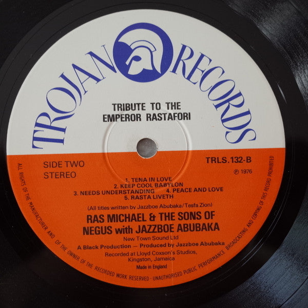 Image of Label Cover of LP - G+/G+ - RAS MICHAEL & THE SONS OF NEGUS WITH JAZZBOE ABUBAKA, Tribute To The Emperor Rastafori (Trojan Records; TRLS 132, UK 1976), Front sleeve is covered in signatures from the band - dated 1976. Disc has some light marks/scuffs but plays well!,  - 4416126C
