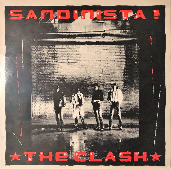 Image of Front Cover of 3xLP - G+/VG - THE CLASH, Sandinista! (CBS; FSLN 1, UK 1980, Newspaper Insert, "Unknown" & Copyright Control Credits.), Disc 2 is VG+. The other 2 discs are VG with light hairlines. Sleeve has ringwear, creases, 3 bumped corners and one torn corner.,  - 2326284E