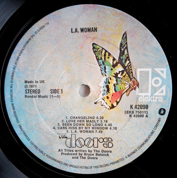 Image of Label Cover of 4744009S: LP - THE DOORS, L.A. Woman (Elektra Butterfly, With W Logo on Rim; K 42090, UK 1970s Reissue, Embossed Sleeve,   &   1971 On Rear Of Sleeve.) Perfect LP and cover, still in opened shrinkwrap, in "Patent no's" paper inner  VG+/VG+