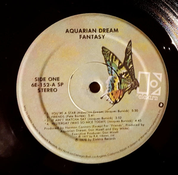 Image of Label Cover of LP - G+/G+ - AQUARIAN DREAM, Fantasy (Elektra; 6E-152, US 1978, Picture Sleeve, Inner, SRC stamped.), Strong G+. Creasing, edgewear & writing on rear sleeve.,  - 4426035E