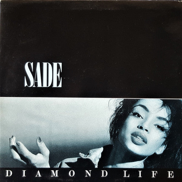 Image of Front Cover of LP - VG/VG - SADE, Diamond Life (Epic (White Labels); EPC 26044, UK 1985 Reissue, Gatefold, 'timtom' + ty in runouts), A few light hairlines. Sleeve has sticker removal area with some damage to main image.,  - 4126008E