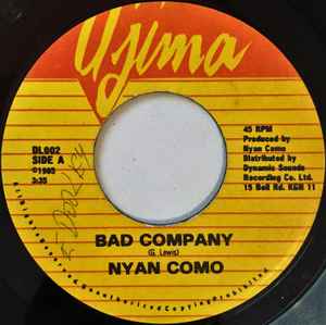 Image of Front Cover of 3153047S: 7" - NYAN COMO, Bad Company (Ujima; , Jamaica 1985) Has a crack that stays together; plays through with crackle and pops. Tear on label.  /F