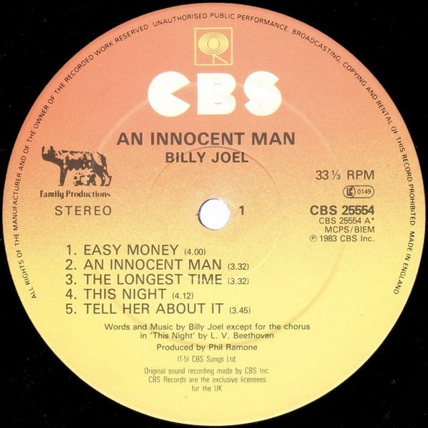 Image of Label of 3644168S: LP - BILLY JOEL, An Innocent Man (CBS Orange/Yellow With Wolf; CBS 25554, UK 1983, Inner & Insert, "Made In England" Rim Text)   VG/VG+