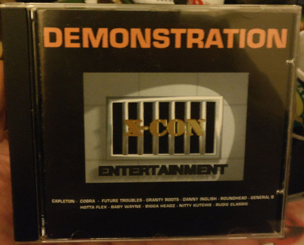 Image of Front Cover of 1554631S: CD - X-CON ENTERTAINMENT, Demonstration (X-con Entertainment; CVR XC 18055-2, UK 1999)   VG+/VG+