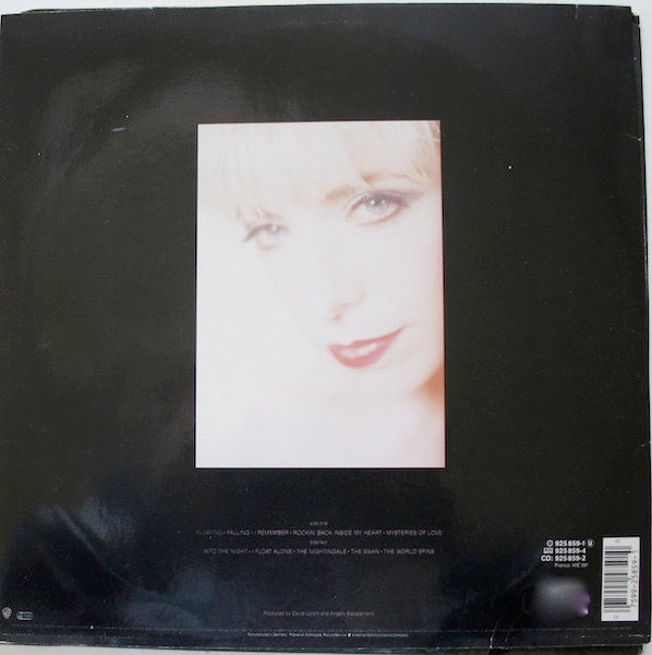 Image of Back Cover of LP - VG/G+ - JULEE CRUISE, Floating Into The Night (Warner Bros. Records; 925 859-1, Europe 1989, Inner), , The haunting debut album by Julee Cruise, who played the nightclub singer in Twin Peaks, is made up of her songs on David Lynch soundtracks and original songs.Mysteries of Love is on Blue Velvet (Original Motion Picture Soundtrack).Falling, Into The Night and The Nightingale are on Soundtrack From Twin Peaks (which came out a year after this release). - 3026190E