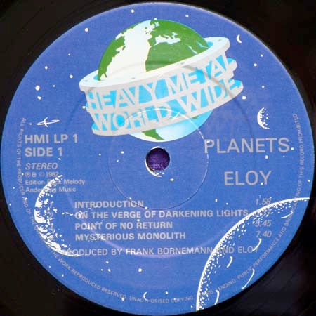 Image of Label Cover of 2114484C: LP - ELOY, Planets (Heavy Metal Worldwide; HMI LP 1, UK 1982, Textured Sleeve, Inner) Clean vinyl, sleeve has minimal wear.  Includes inner  VG/VG+