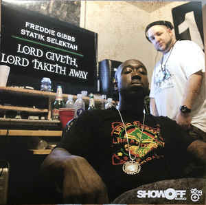 Image of Front Cover of LP - VG+/VG - STATIK SELEKTAH & FREDDIE GIBBS, Lord Giveth, Lord Taketh Away (Omerta Inc; OMINC024, ShowOff Records    none, ESGN    none, US 2018 Reissue, Picture Sleeve), Still in stickered shrink wrap. Disc is a strong VG, light hairlines only.,  - 2726271E