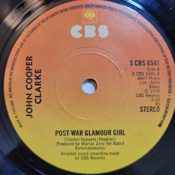 Image of Label Cover of 2514269C: 7" - JOHN COOPER CLARKE, Post-War Glamour Girl (CBS; S CBS 6541, UK 1978, Picture Sleeve, Stereo Right Aligned With 45 On Both Labels) Date stamp and writing in pencil on rear of sleeve.  VG/VG