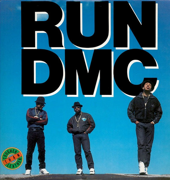 Image of Front Cover of 3014096C: LP - RUN-DMC, Tougher Than Leather (Get On Down; GET 51320, US 2019 Reissue, Blue Transparent Vinyl) Opened Instore.  Long manufacturing mark along left side of sleeve  VG+/EX