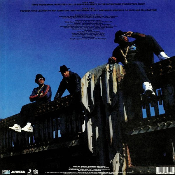 Image of Back Cover of 3014096C: LP - RUN-DMC, Tougher Than Leather (Get On Down; GET 51320, US 2019 Reissue, Blue Transparent Vinyl) Opened Instore.  Long manufacturing mark along left side of sleeve  VG+/EX