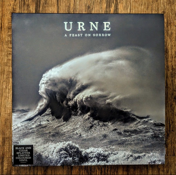 Image of Front Cover of 3714254C: 2xLP - URNE, A Feast On Sorrow (Candlelight Records; CNDL800054P, UK 2023, Gatefold, 2 Inserts, Limited Edition, Half Black / Half Clear w/ Black Splatter Vinyl) Opened instore, Still in shrinkwrap  EX/EX