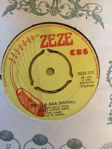 Image of Front Cover of 3754105S: 7" - EAGLES LUPOPO BAND, Masomo Kuvutsa / Shivela Sha Swahili (Zeze; ZEZE-012, Kenya , Plain sleeve, 3 prong centre) Marks on disc.  /G