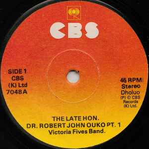 Image of Front Cover of 3754122S: 7" - VICTORIA FIVES BAND, The Late Hon. Dr. Robert John Ouko (CBS; CBS(K) Ltd 7048, Kenya 1990, Plain sleeve) Marks on disc.  /G