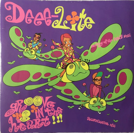 Image of Front Cover of 4614170C: 12" - DEEE-LITE, Groove Is In The Heart (Elektra; EKR 114T, UK 1990, Picture Sleeve, Cat Number In White Box On Sleeve) Sleeve has a very small patch of sticker damage but is otherwise very nice. Lightest of marks to disc.  VG/VG+