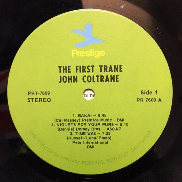 Image of Label Cover of 4644467S: LP - JOHN COLTRANE, The First Trane (Prestige; PR 7609, US 1970s Reissue) Hairlines and mottling. Edge and ring wear, general sleeve wear. Tape to top edge.  G+/VG