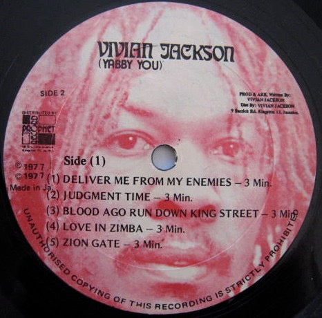 Image of Front Cover of 4914578C: LP - THE YABBY YOU VIBRATION (YABBY YOU), Deliver Me From My Enemies (Vivian Jackson (Yabby You) (Red Labels); , Jamaica 1977, No Sleeve) Quite a few light marks to disc. Plays through with some light surface noise.  /G+