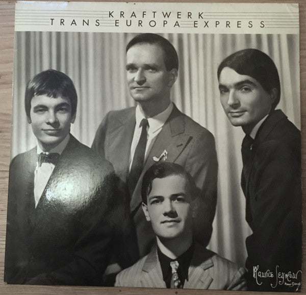 Image of Front Cover of 5044258S: LP - KRAFTWERK, Trans Europa Express (Kling Klang; 1C 064-82 306, Germany 1977, Inner, Poster, No Debossed EMI Stamp on Back of Sleeve) Clean copy, Strong VG on the sleeve with a very faint lpatch of laminate removal and a light crease. Poster is in great shape  VG/VG+