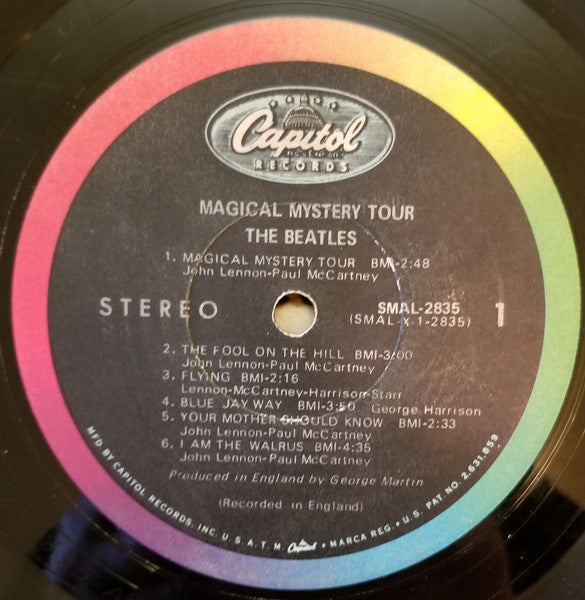 Image of Label Cover of 5044270S: LP - THE BEATLES, Magical Mystery Tour (Capitol rainbow; SMAL 2835, US 1967, Pasteback Gatefold Sleeve, Stapled-in Booklet, Jacksonville Pressing, "Stereo" on label close to center) Hairlines and scuffs, light edge wear, name written on front cover, booklet intact and stapled in  VG/VG